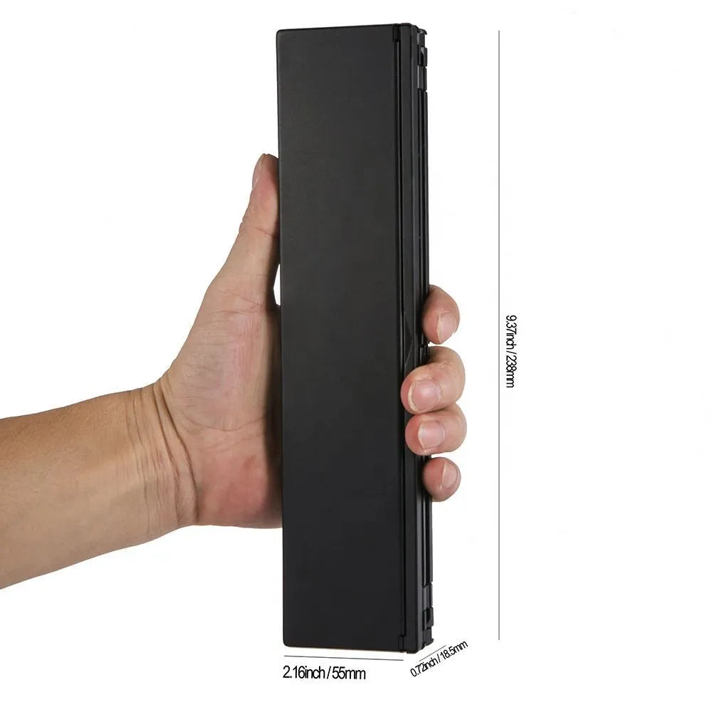 Black foldable Bluetooth keyboard shown alongside tablet demonstrating 8-inch compact size and portable design