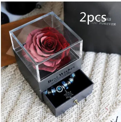 Eternal Flower gift box with preserved roses and carnations inside, measuring 8.5 cm square by 10.5 cm high