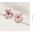 Flower stud earrings for women in alloy with white and pink electroplated colour options