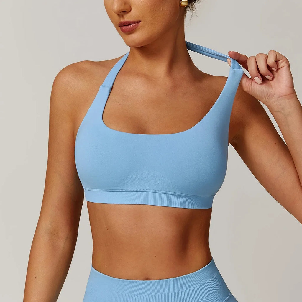 Women's halter neck yoga sports bra with removable pads in various colours.