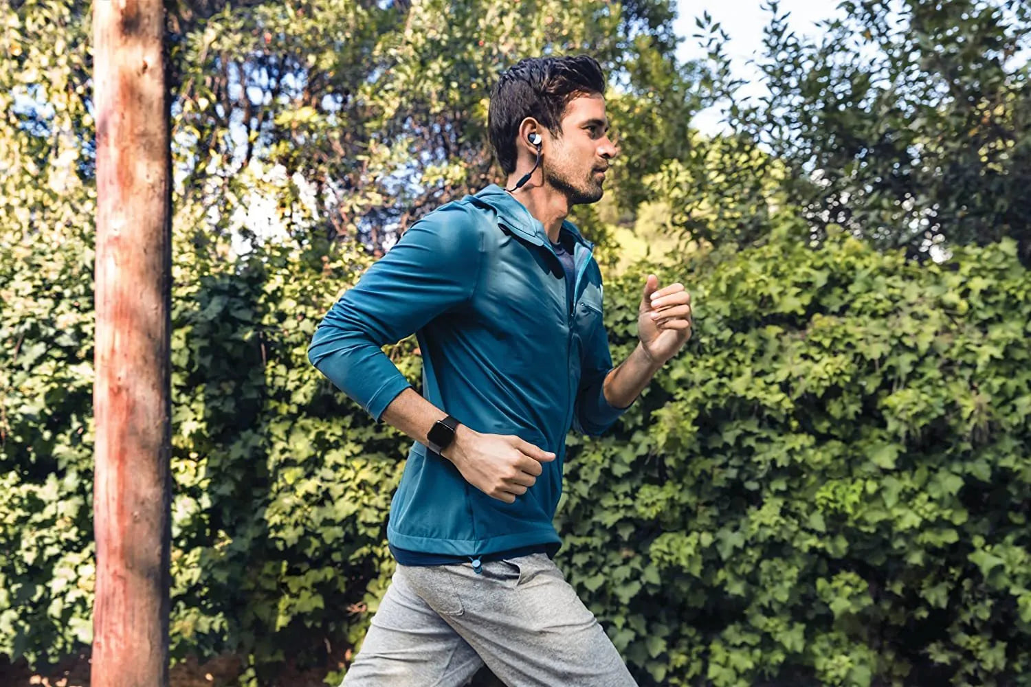 Black smart watch with heart rate monitor and sleep tracking on a silicone wristband, showing 1.4-inch screen.