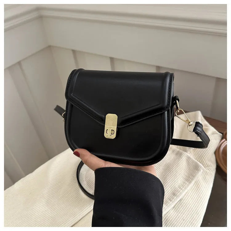 Soft PU leather horizontal square messenger bag with clamshell opening in khaki colour.