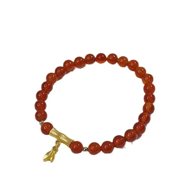 Handmade red agate bracelet with dragon and lucky bag Chinese designs for women.