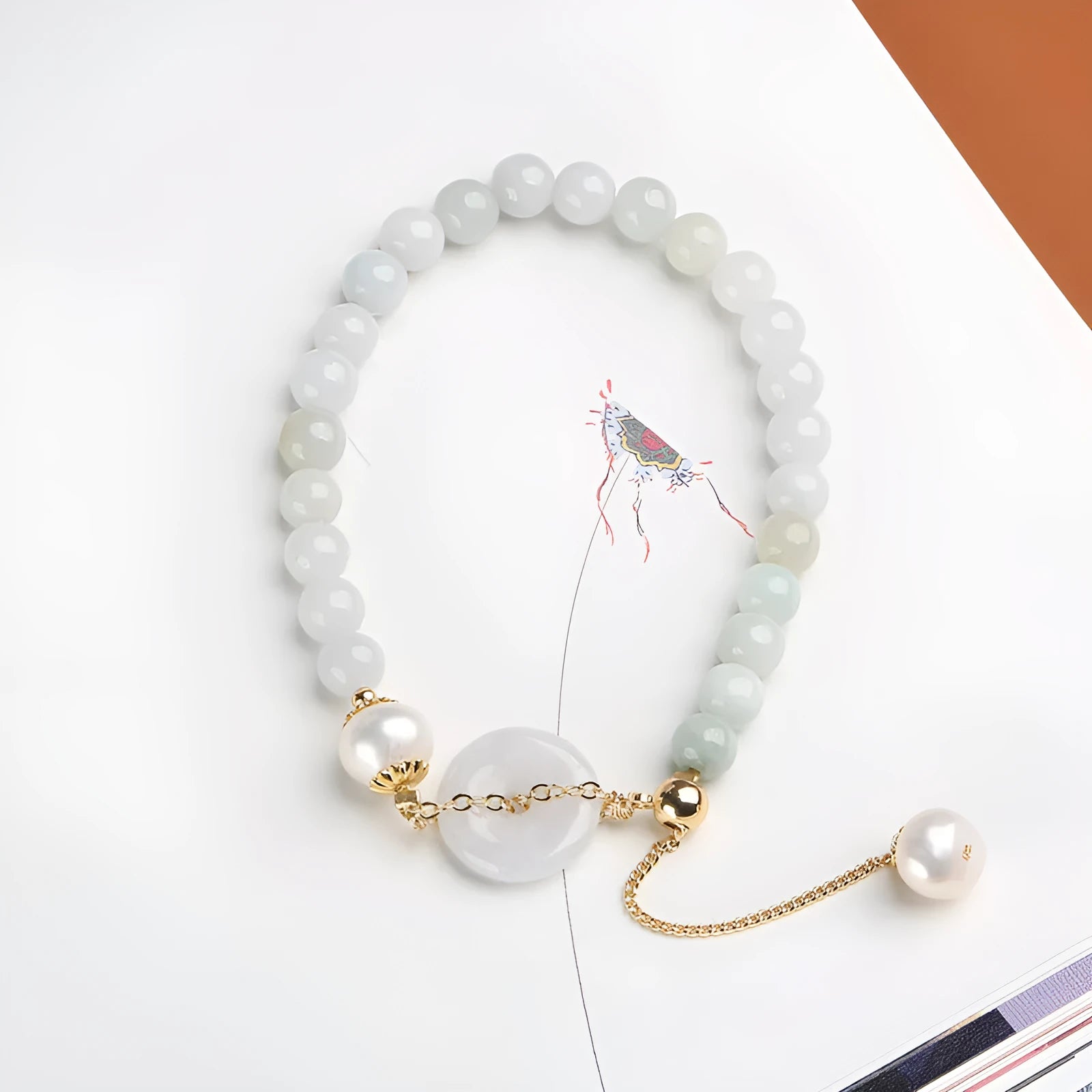 Jade and pearl bracelet with emerald peace buckle clasp and round pendant