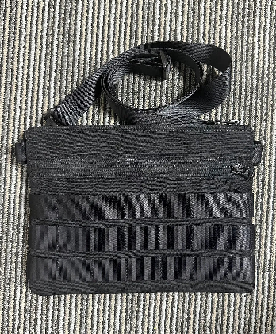 Black Oxford cloth outdoor belt bag with compact 18cm by 3.5cm dimensions for tactical and sports use