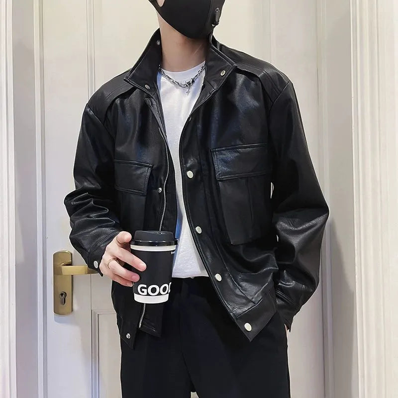 Men's black Korean style PU leather jacket with side pockets on a hanger