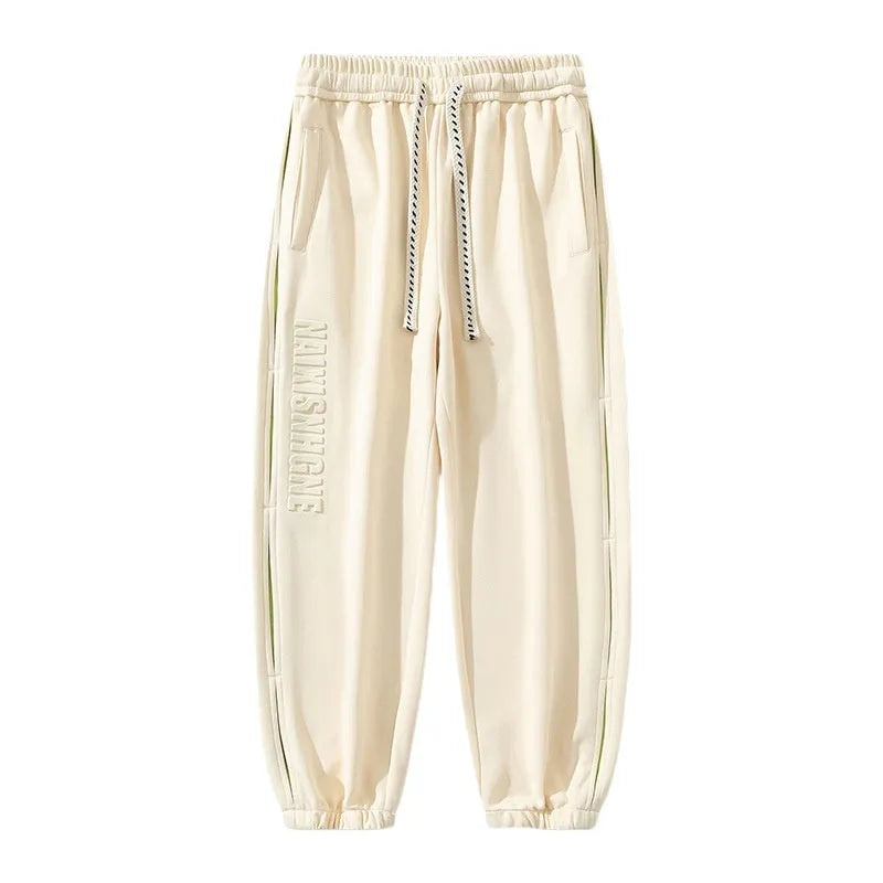 Men's loose fit ankle banded trousers with stitching detail in various colours