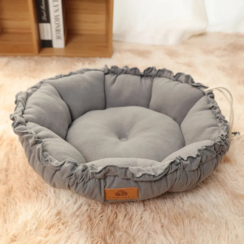 Grey reversible donut cat bed showing sherpa and velvet sides, suitable for indoor cats.