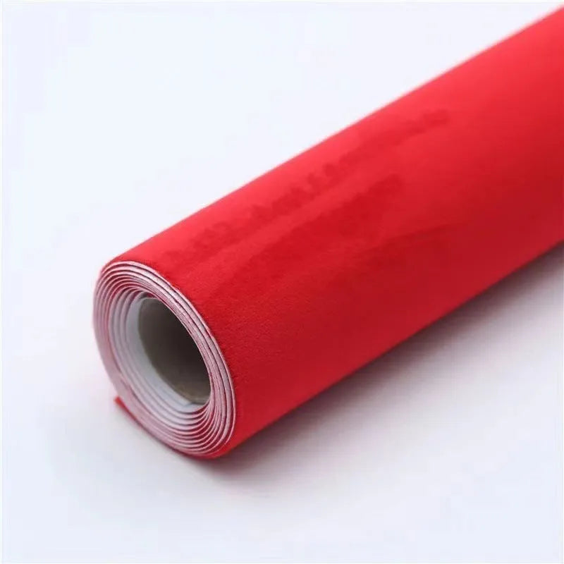 A sheet of self-adhesive black leather suede material with a ruler showing its 0.5mm thickness.