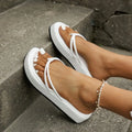Women's thick sole flip-flops in multiple colours with herringbone pattern PU strap and rubber sole.