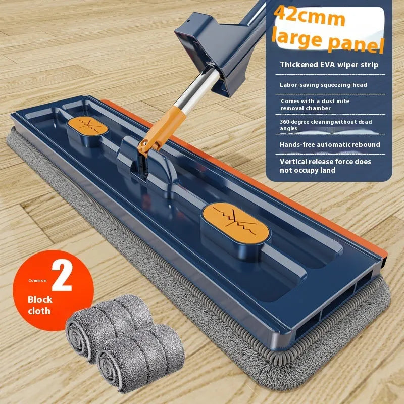 Large flat mop with blue cloth on a wooden floor, showing its 360-degree rotating head and long stainless steel handle.