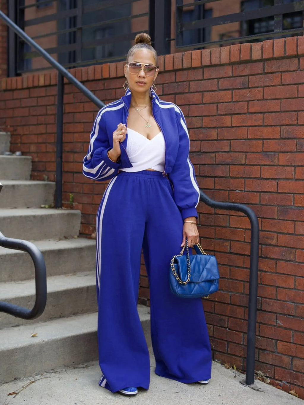 Men's striped two-piece sweater suit set with zipper detailing in streetwear style