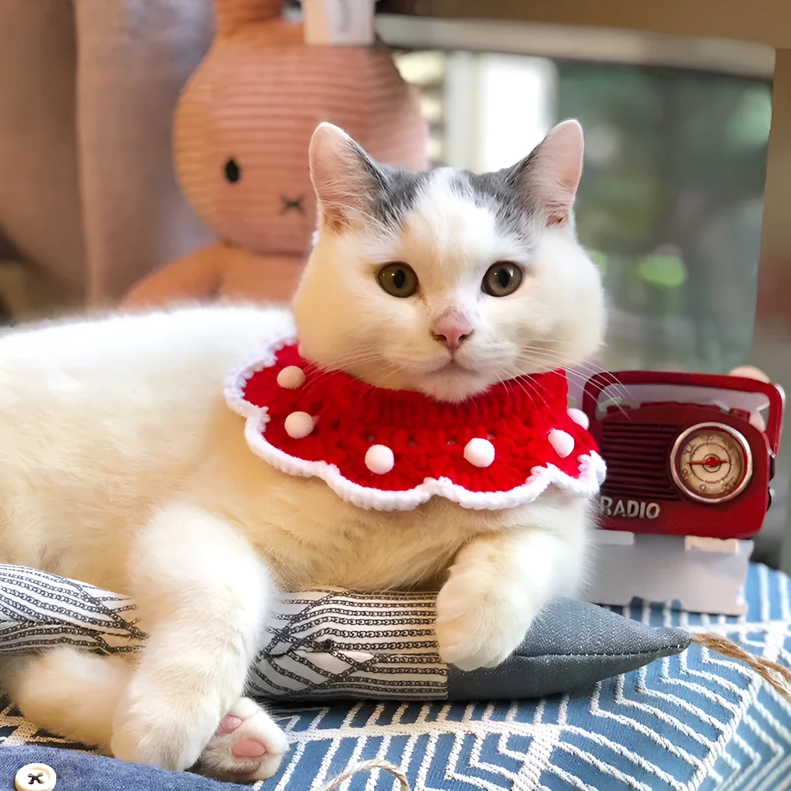 Cartoon pattern wool knitted collar for small pet cat or dog, shown in milk cotton yarn.
