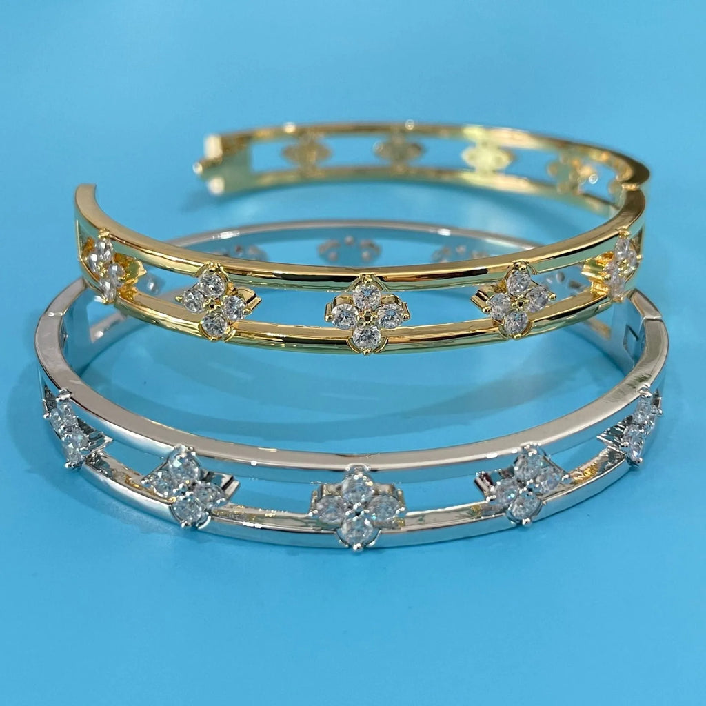 Gold or silver hollow women's bracelet with four-leaf clover design and zircon crystals