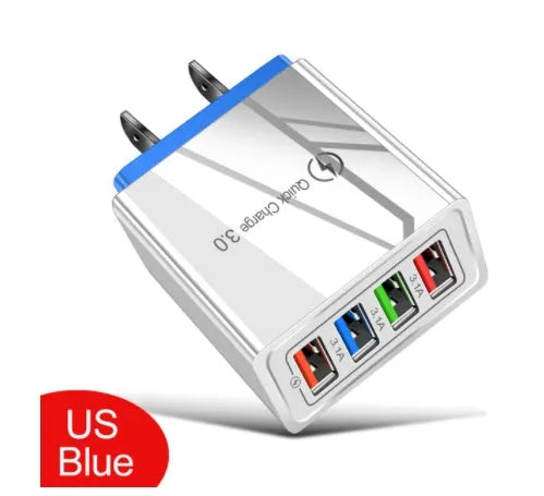 Dark blue 4-port USB wall charger with EU plug next to mobile phone