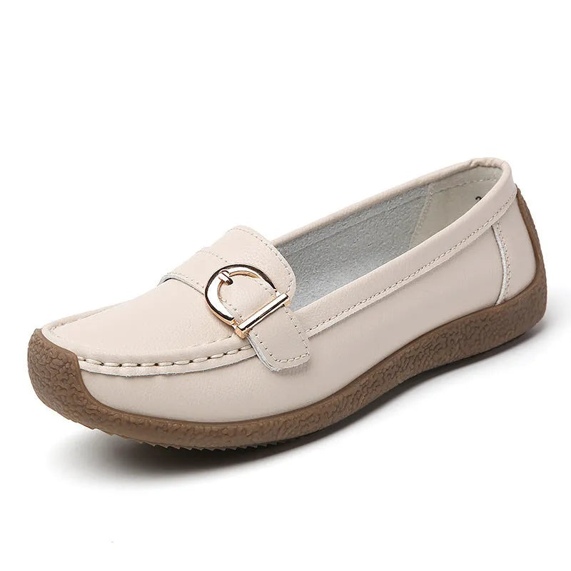 Women's casual flat loafers in artificial PU leather with a rounded toe and beef tendon sole.