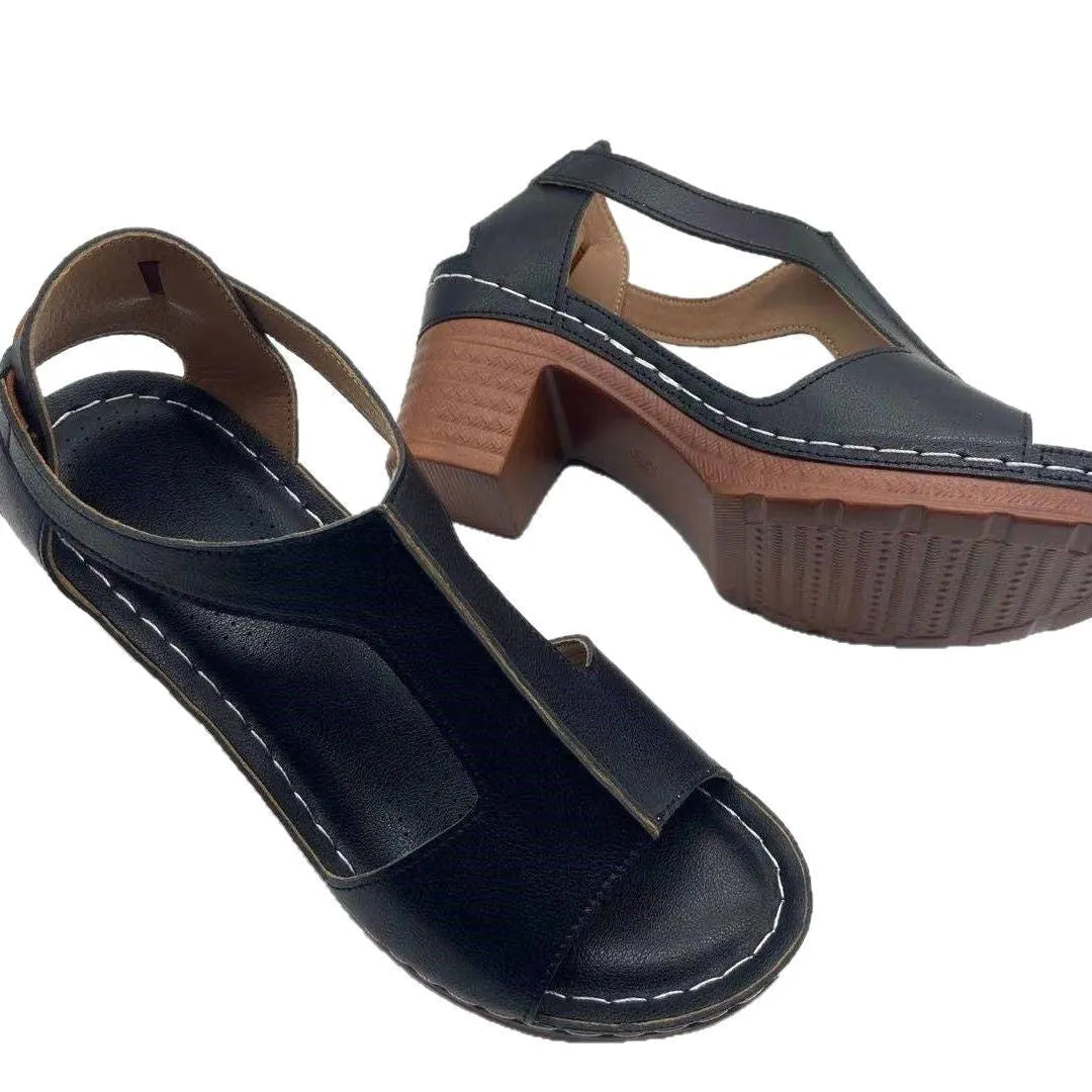 Women's beige peep toe wedge sandals with a buckle strap and low Roman-style heel.