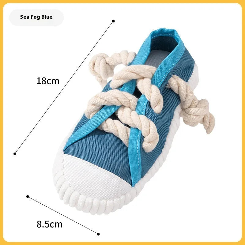 Plastic dog slipper chew toy in yellow, black and blue colours with textured bends for dental cleaning