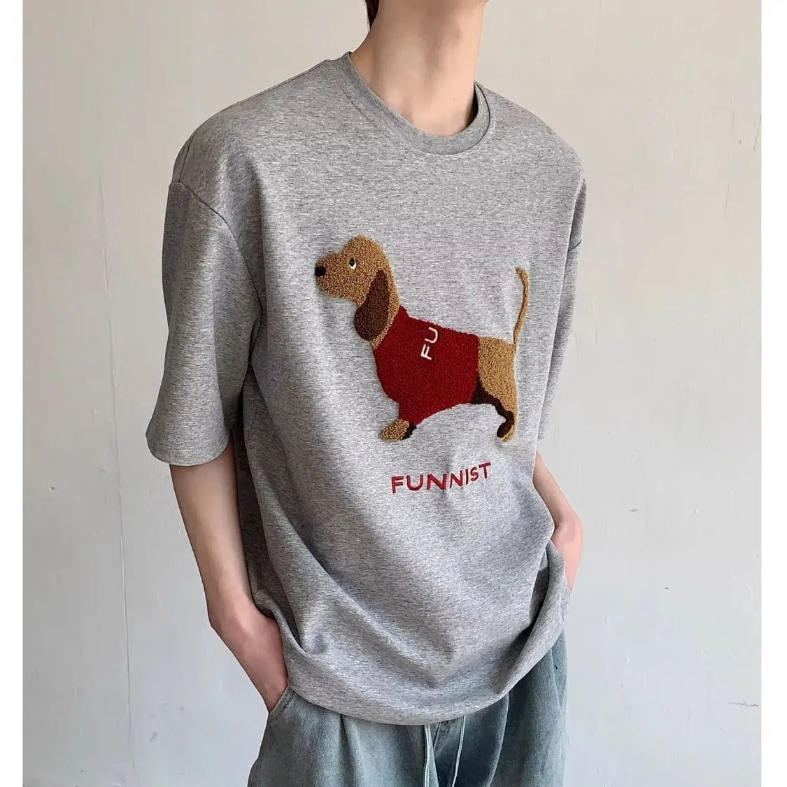 Men's grey cotton T-shirt with embroidered sausage dog design on front, round neck and short sleeves