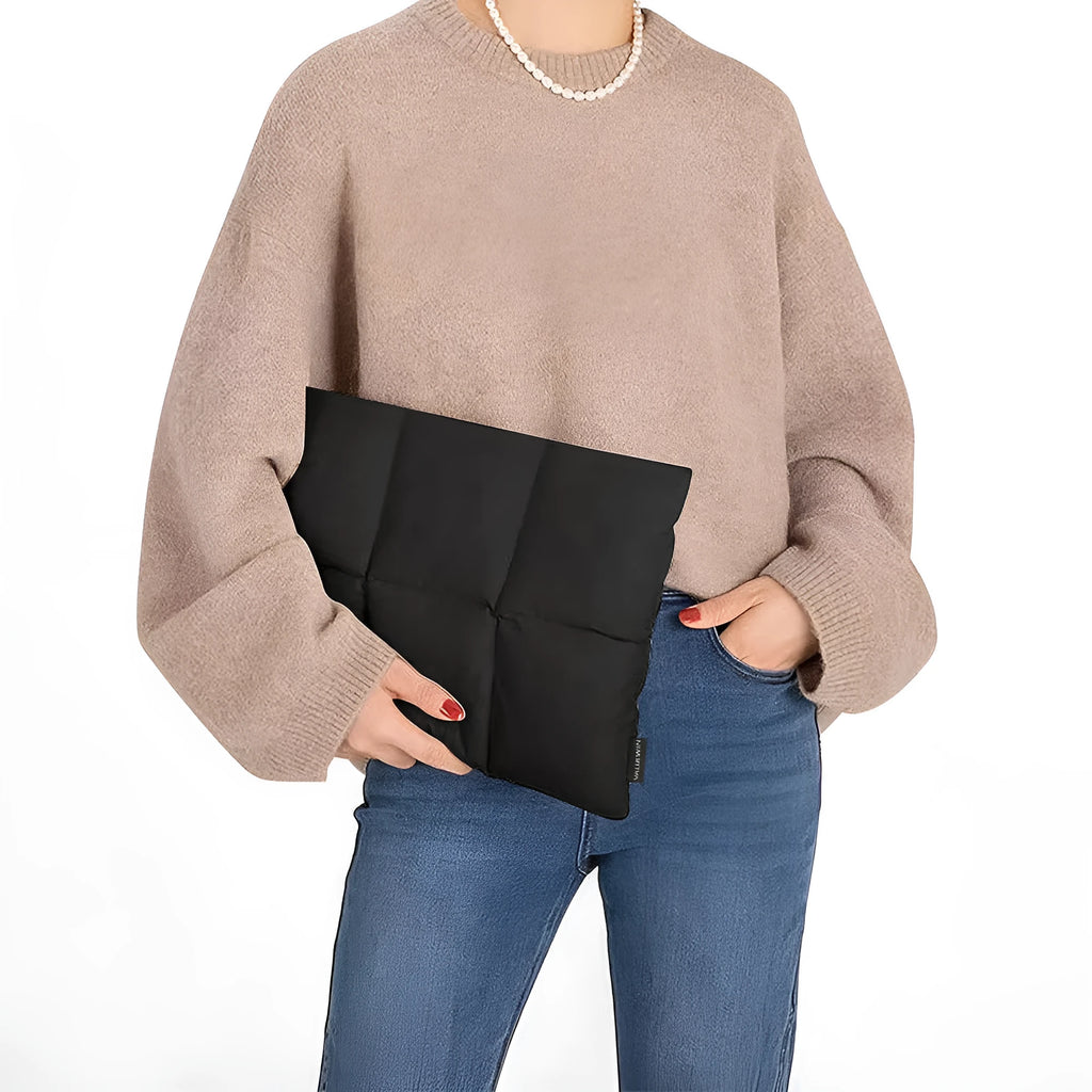 Soft black polyester laptop sleeve for a 13-15.6 inch laptop, showing fluffy texture and sewing thread detail.