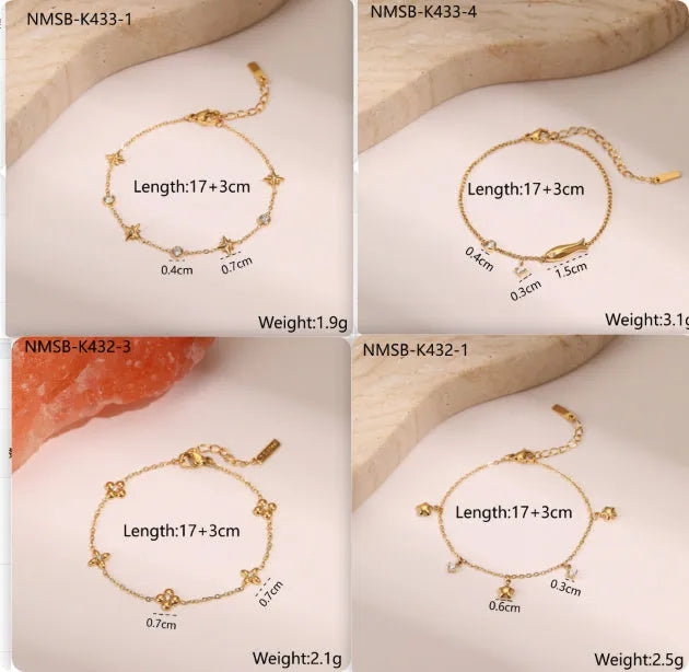 Gold plated stainless steel bracelet with a detailed zircon star pendant on a woman's wrist.