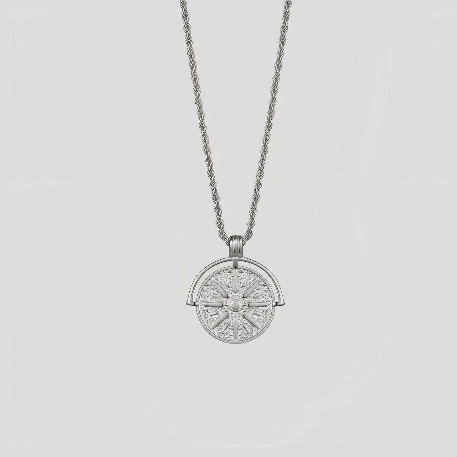 Gold titanium steel sunflower pendant necklace with geometric star embossing on adjustable hemp chain.