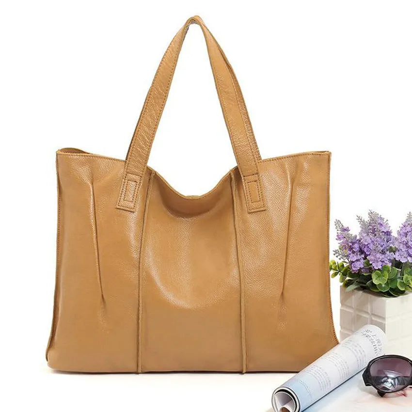Top grain leather single shoulder tote bag in Apricot colour with stitching and patchwork design