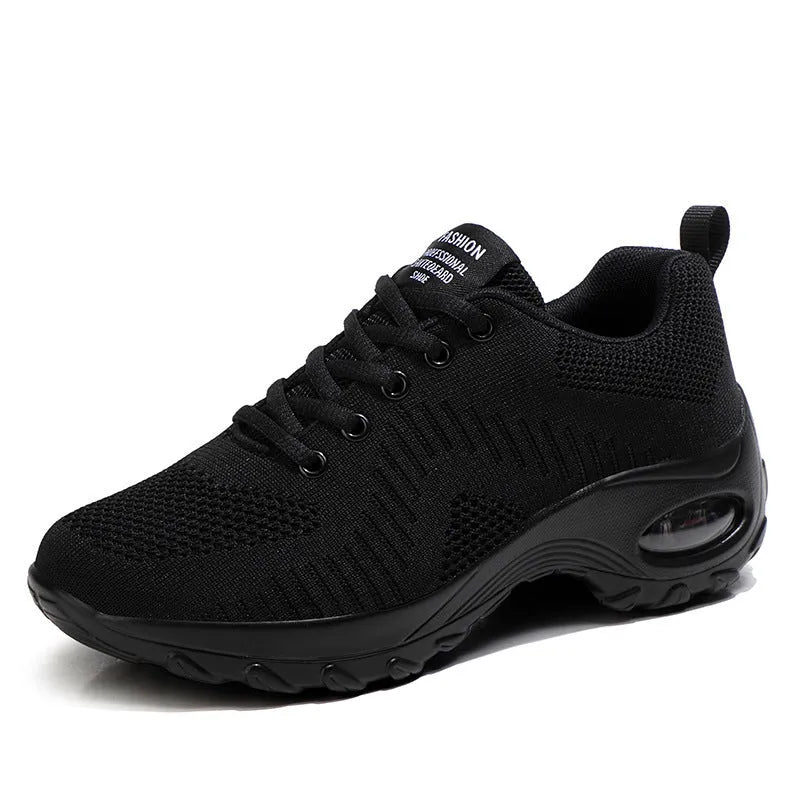 Red and black women's low-top mesh sneakers with round toe and front lace-up closure.