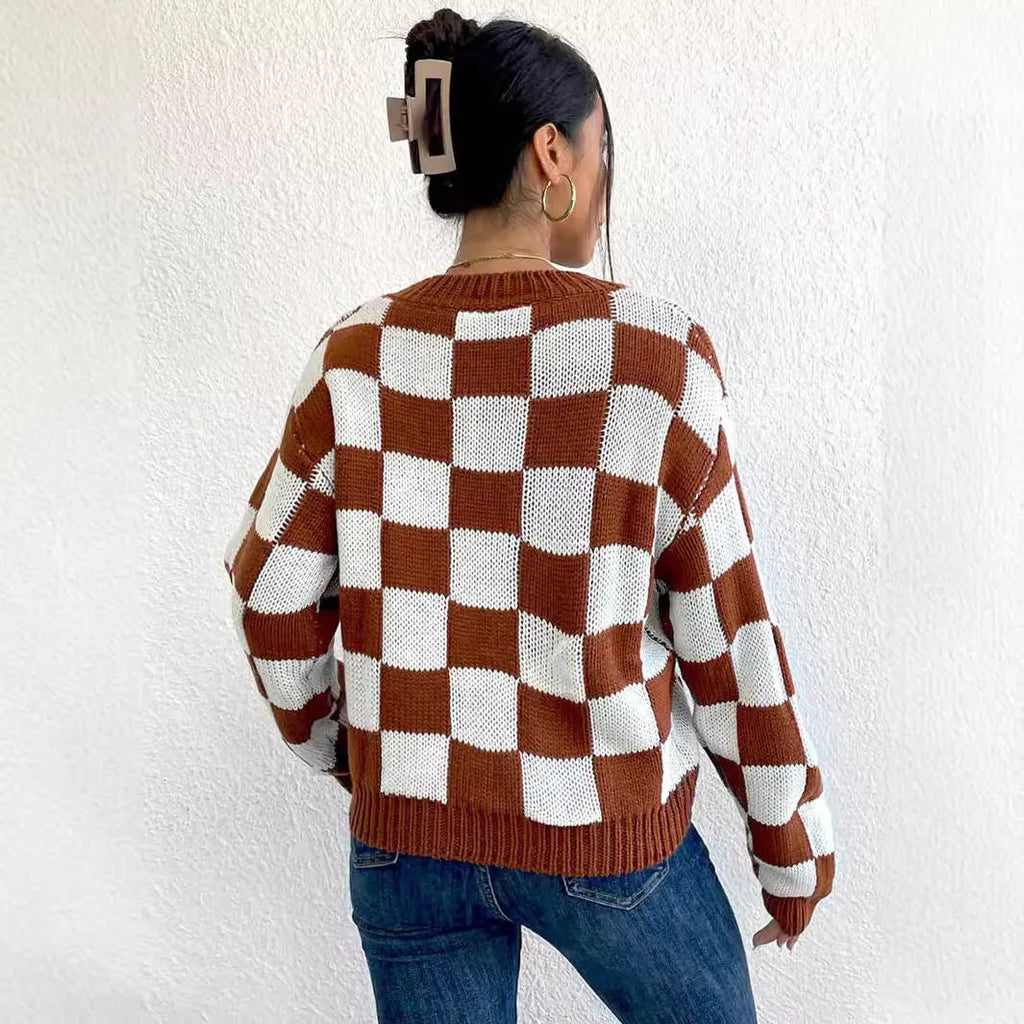Dark brown plaid pattern loose fit pullover sweater with long sleeves and a round neck.
