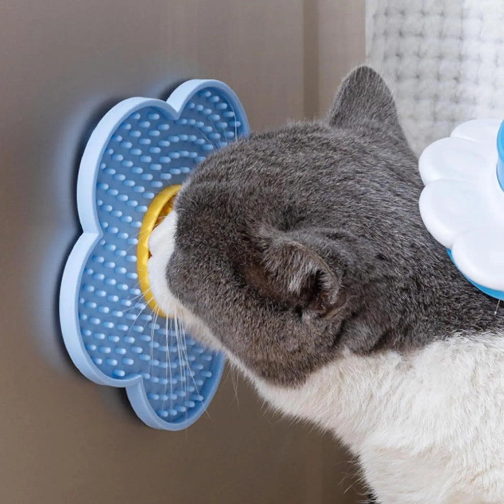 Flower-shaped silicone lick pad for cats and dogs with multiple suction cups on the back, shown in a choice of colours.