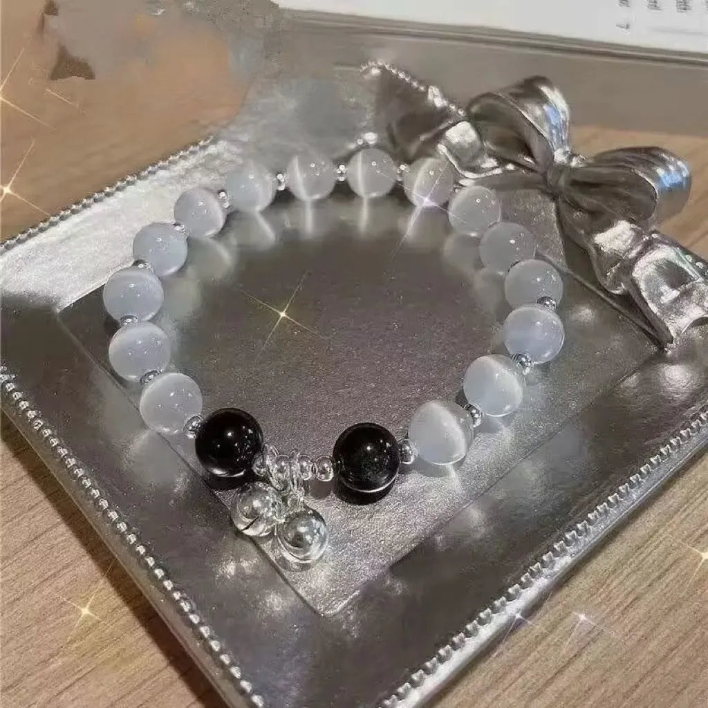 Handcrafted glass butterfly bracelet with drop-shaped moonlight grey beads and special-interest design