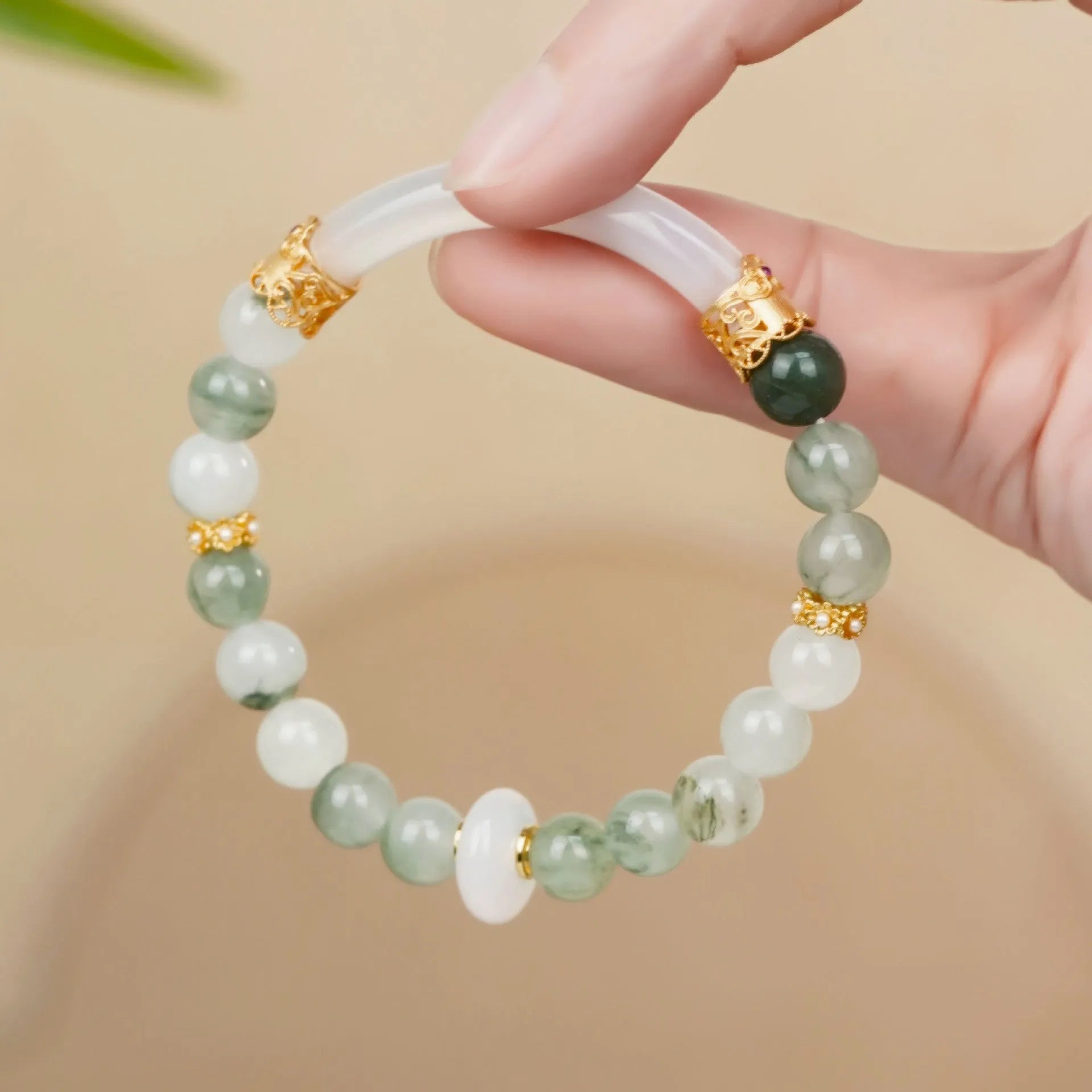 Emerald green jade bracelet with floating flower girl design in a half bracelet style.