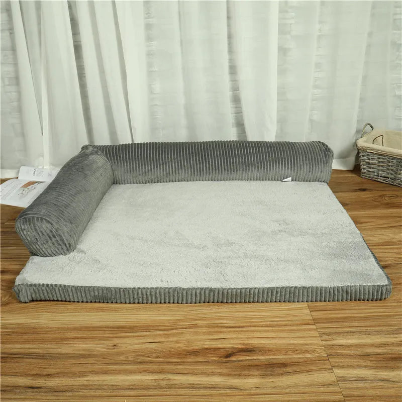 Corduroy bolster dog bed in grey, showing bilateral raised sides and non-slip base.
