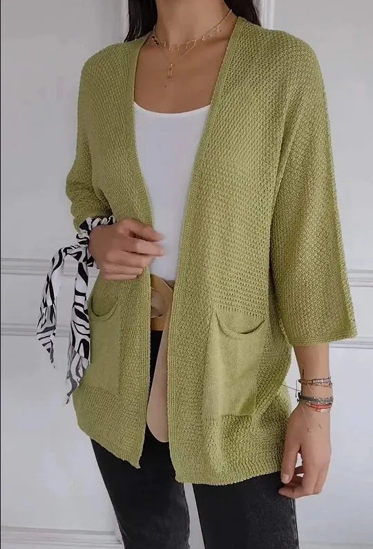 Women's thin waffle weave cardigan coat in army green with nine-quarter sleeves and pockets.