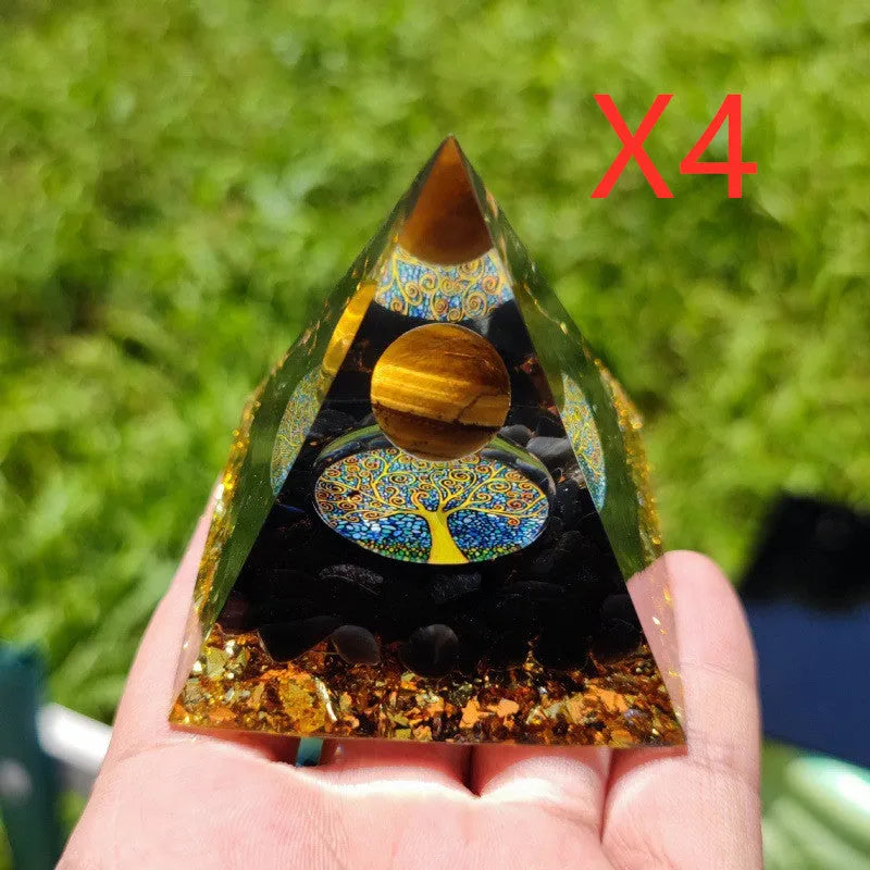 Clear epoxy resin pyramid ornament with embedded coloured crystal gravel inside, measuring 6cm.