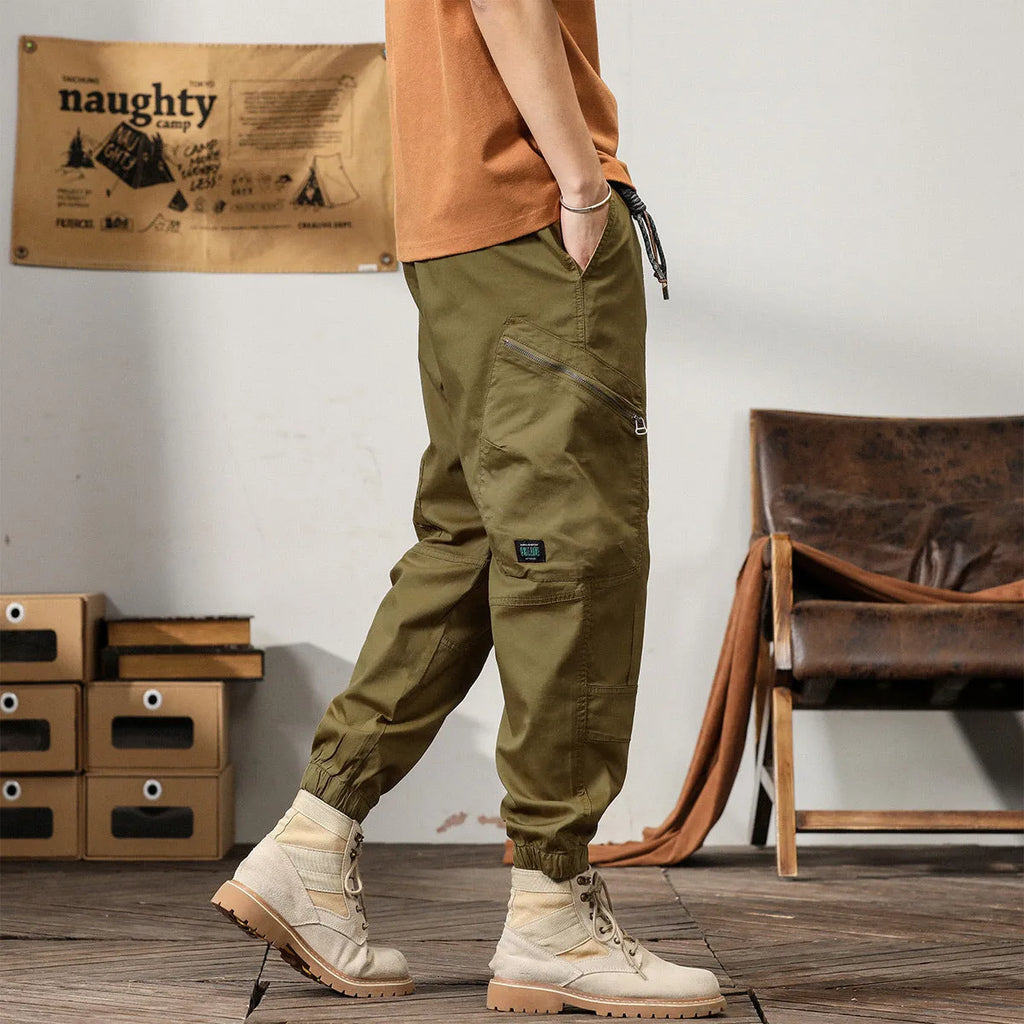 Men's cotton retro harem pants in tapered fit with ankle banding and zip fly