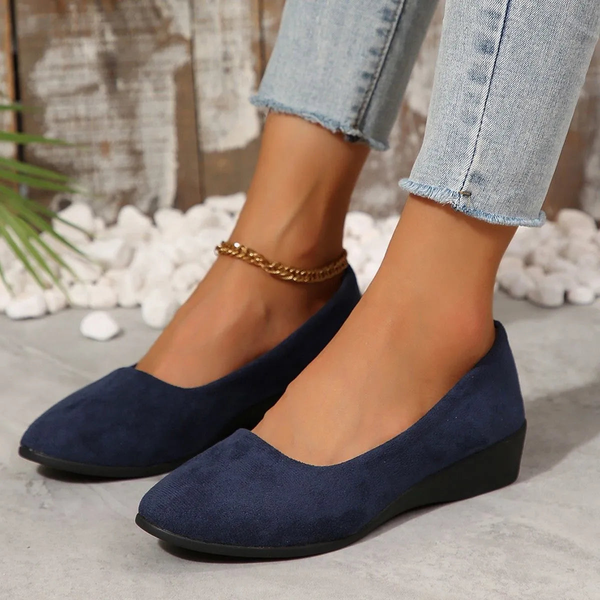 Women's plus size low wedge pumps in Gommino style with pointed toe and suede upper.