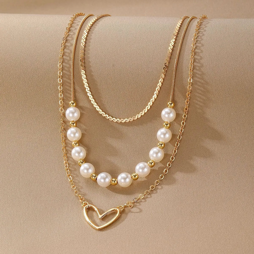 Vintage gold necklace with heart pendant on pearl-style chain, adjustable 41-50cm length