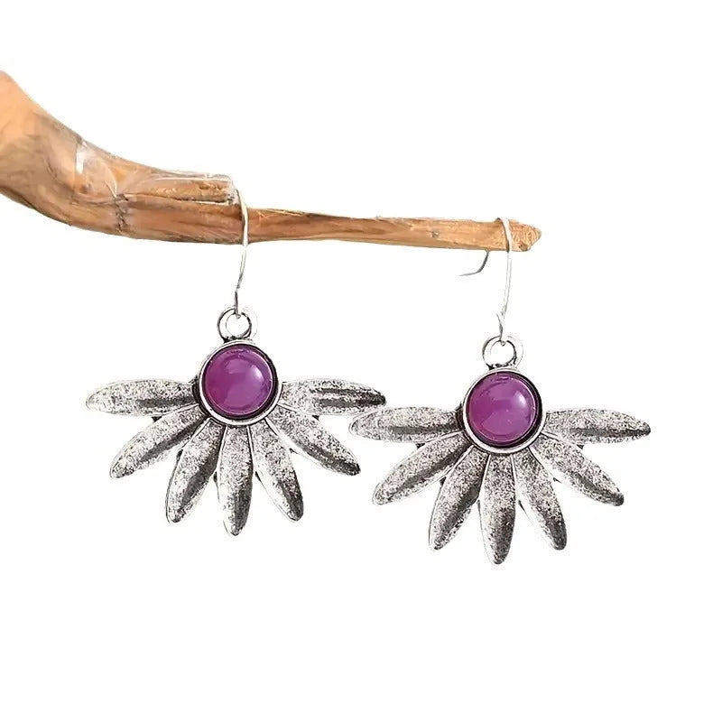 Purple resin bohemian flower statement earrings with animal zodiac design on alloy frame.