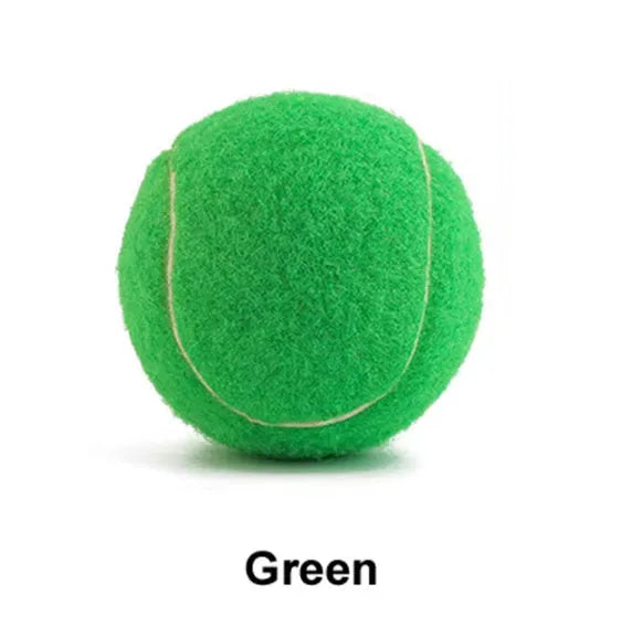 6.3 cm diameter solid rubber dog tennis ball in assorted bright colours on a green lawn.