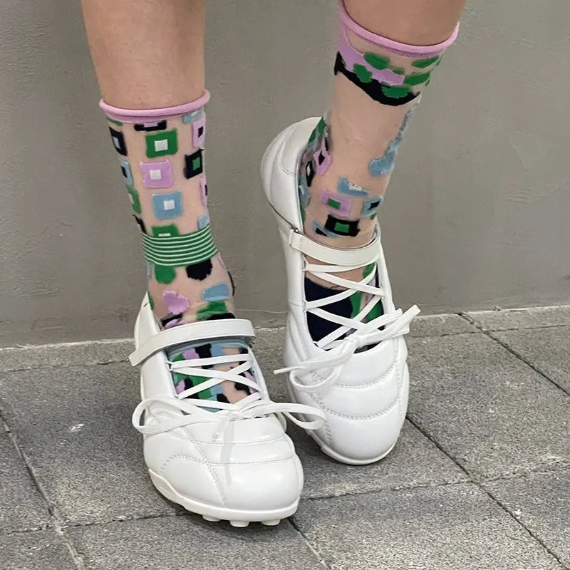 Women's silver lace-up bow sports shoes with a low-top and round toe on a white background.