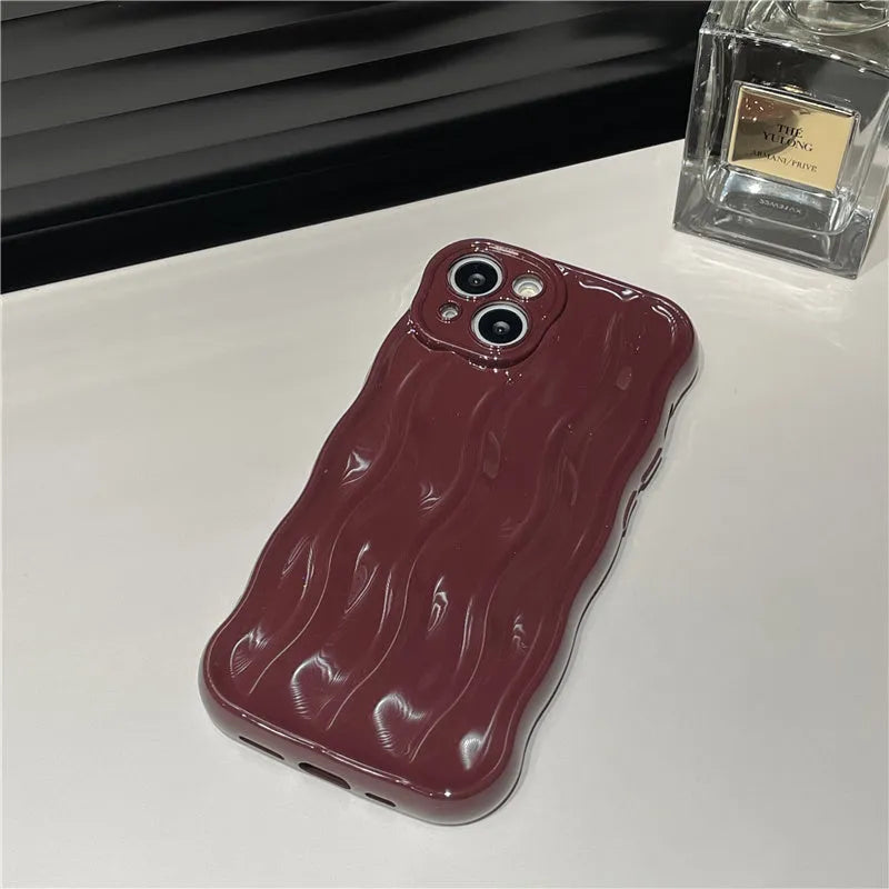 Silicone iPhone 17 case with water ripple texture in burgundy, green, silver, purple, and beige colour options
