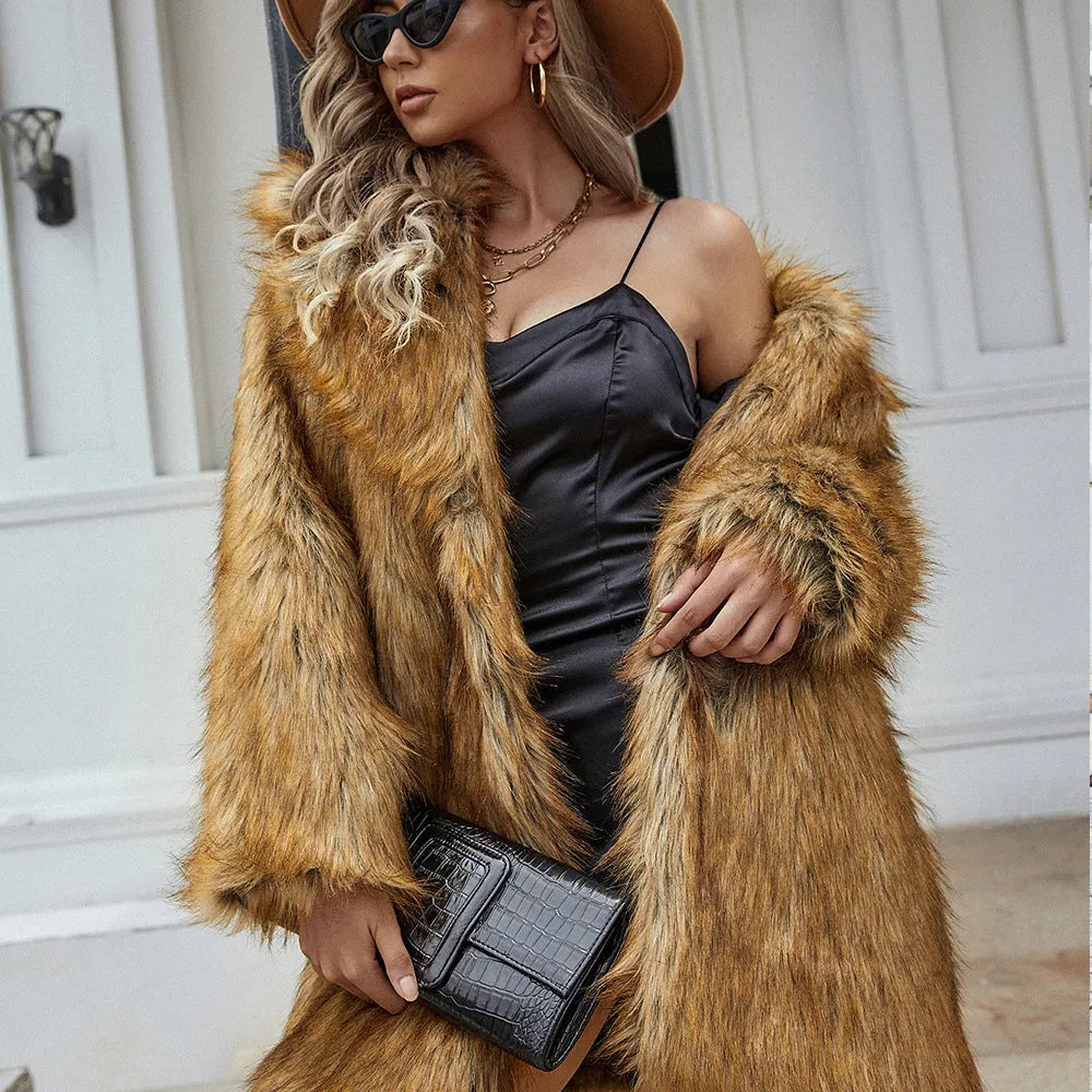 Yellow loose-fitting women's faux fur coat on a hanger, showing regular sleeves and a plush texture.