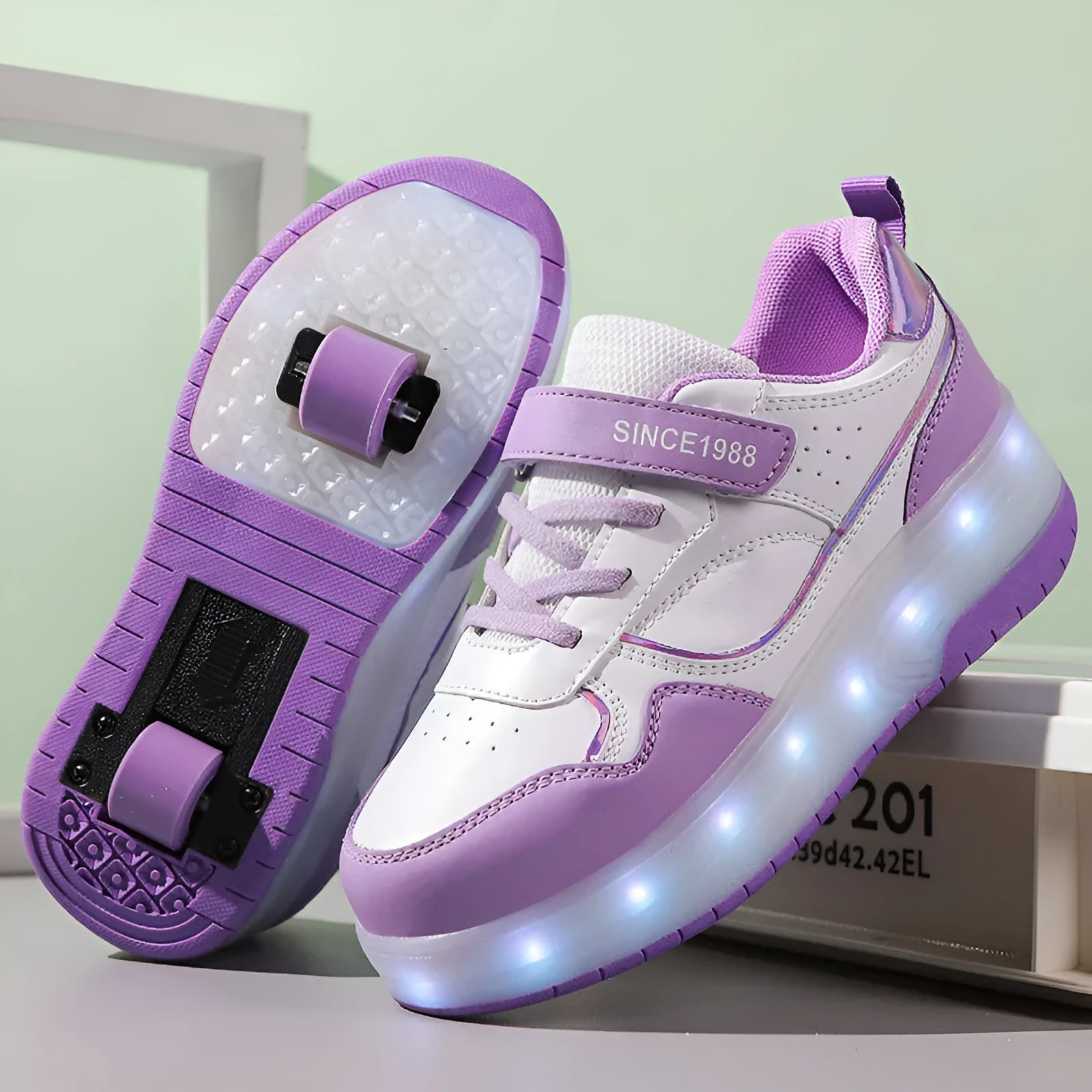 Children's charging flash roller skates with illuminated LED wheels in pink, available in two and four-wheel designs.