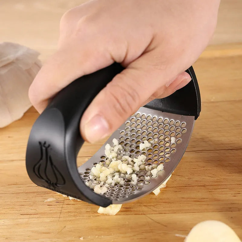 304 stainless steel garlic press in black, blue, green, and pink colour options