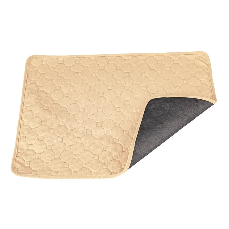Pet Parents grey and khaki washable dog pee pads in multiple sizes on a wooden floor.