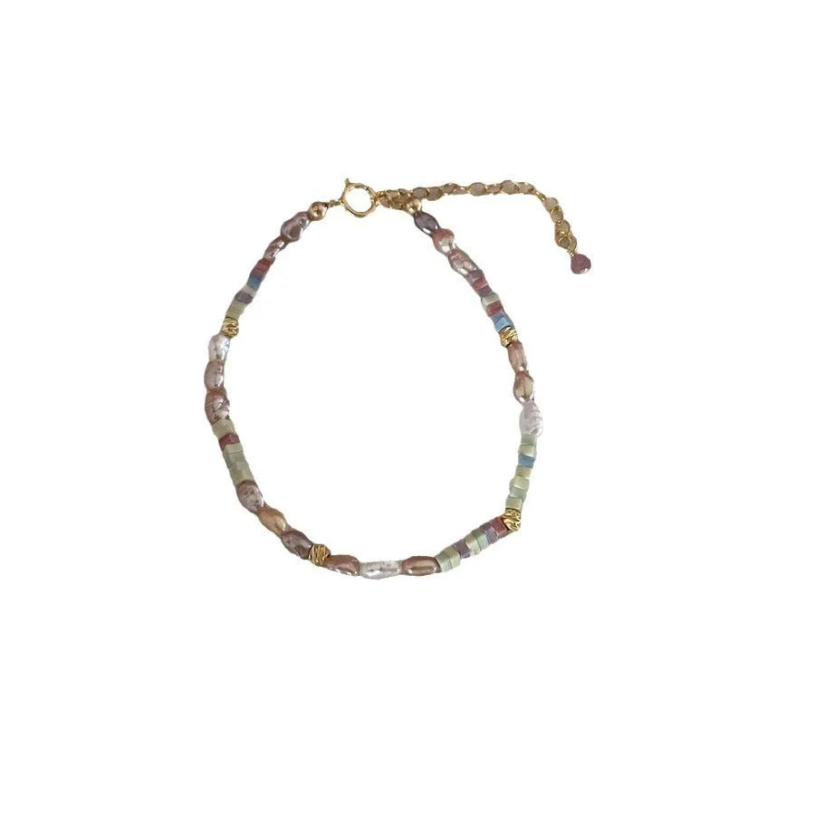 Purple freshwater pearl bracelet and necklace set with 14K gold-plated accents and irregular pearl shapes