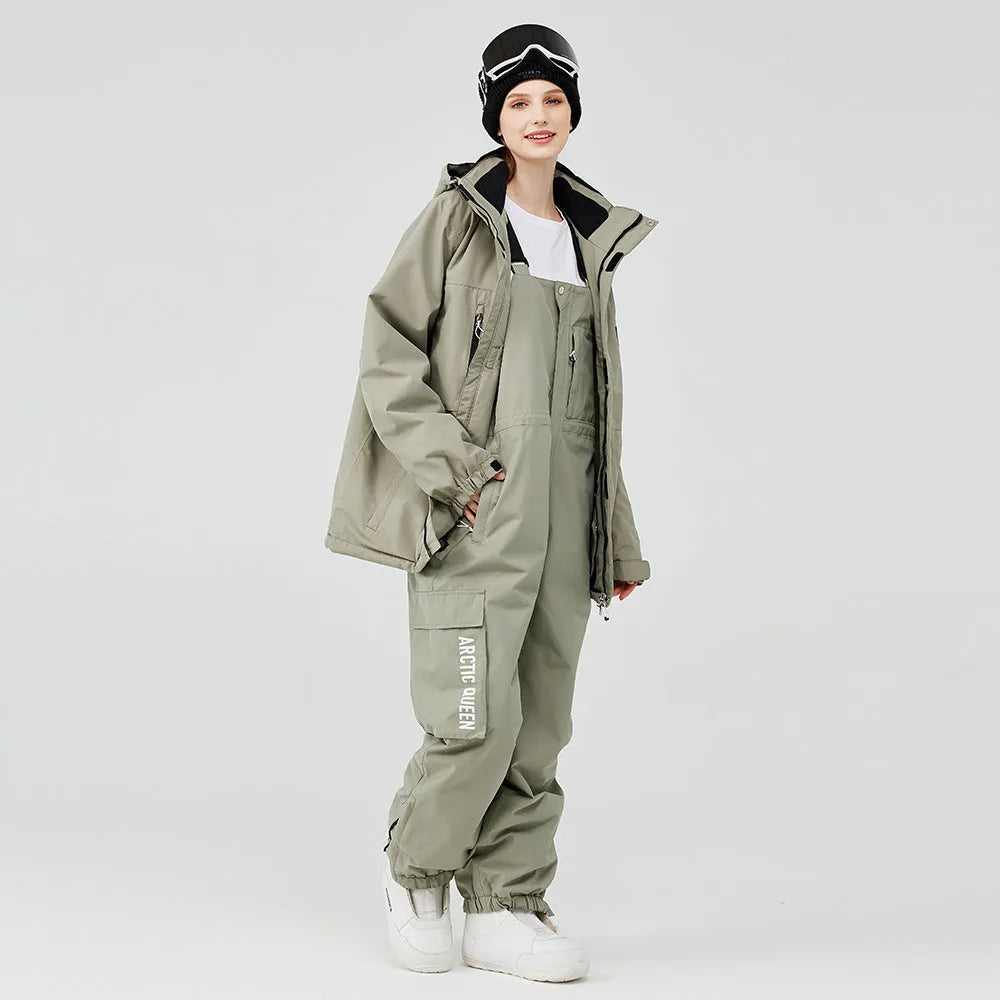 Men's and women's waterproof winter ski suit in blue top with grey blue trousers.