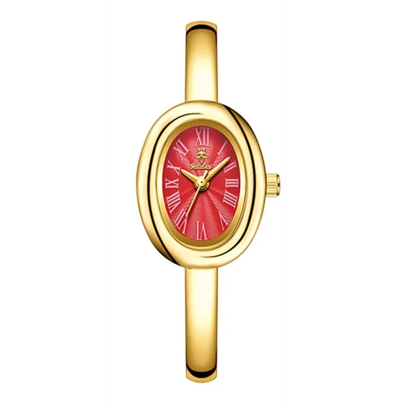 Women's slim oval retro quartz watch in gold colour on wrist