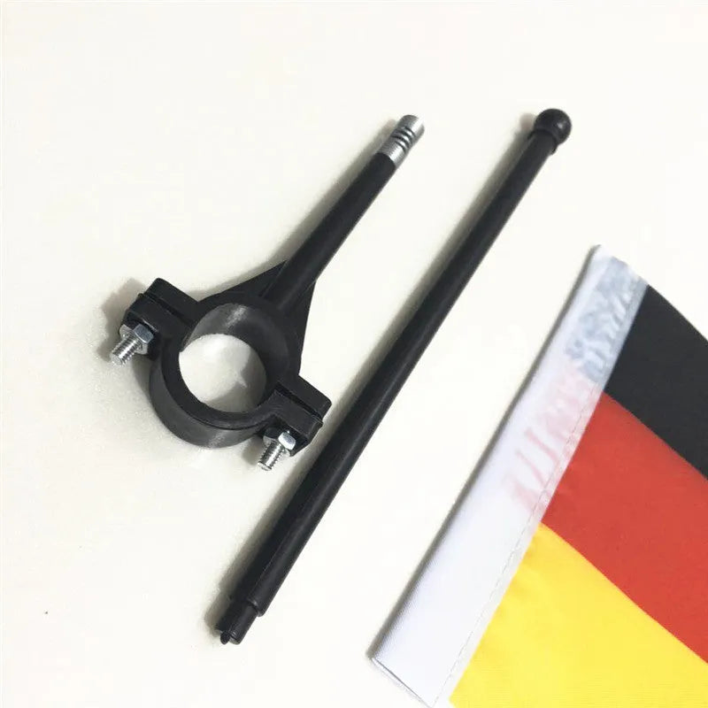 Square polyester cycling flag mounted on plastic handlebar pole for bicycle safety signals